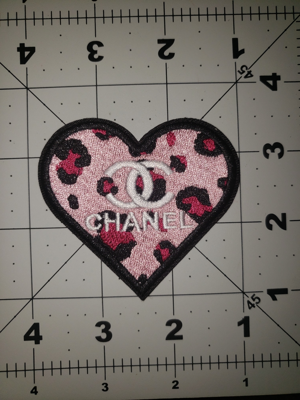 CHANEL Pink Leopard Heart Patch with Black Trim